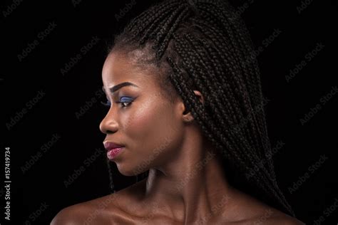 Dark Skinned Model With Turning Head To The Left Side On Black