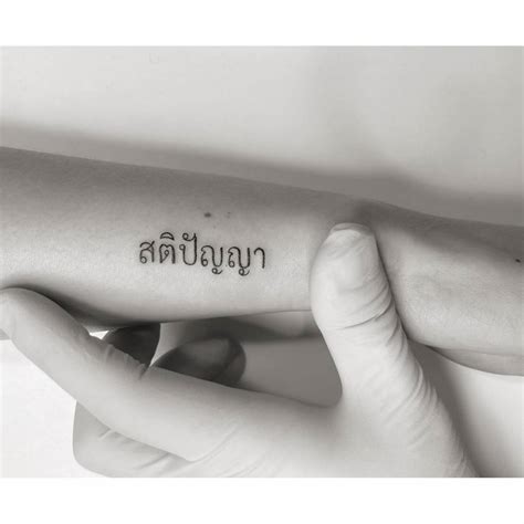 Thai Lettering Tattoo Located On The Wrist