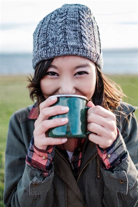 Beautiful Asian Woman Drinking Hot Tea In A Mug By Stocksy Contributor Take A Pix Media