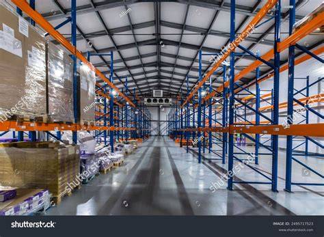 organized warehouse interior featuring high racks stock photo