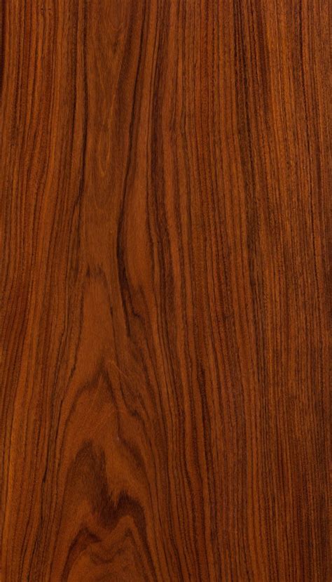 An Image Of Wood Grained Surface With Dark Brown Stain On The Top And