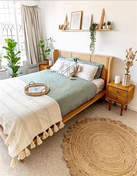 A Bedroom With A Bed Nightstands And Potted Plants