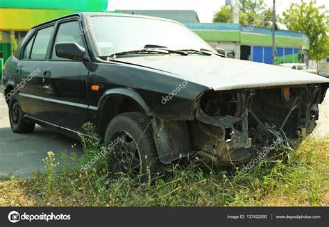 Destroyed Car On The Street Stock Photo Belchonock