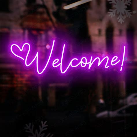 a purple neon sign that says welcome