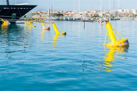 Yellow Mooring Buoys Blue Luxury Boat Bow In Marina At Port Vauban