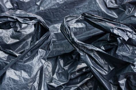 Plastic Texture Of A Piece Of Crumpled Black Cellophane Stock Image