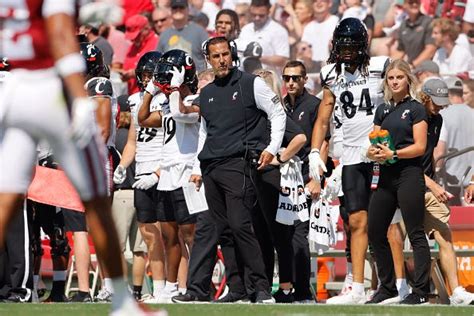 Cincinnati Bearcats' helmets came off several times at Arkansas