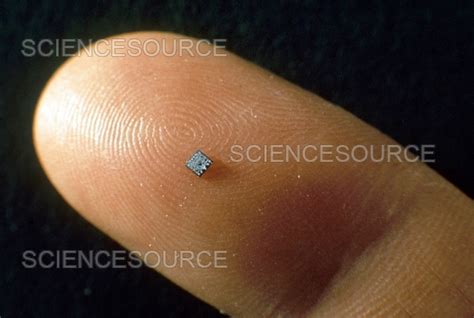 Microchip On Finger For Size Compariso Stock Image Science Source