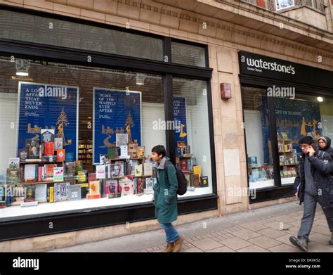 People Passing Waterstones Book Store Window Display In Gower Street