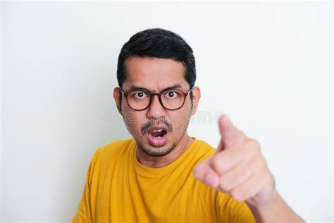 Closeup Portrait Of Adult Asian Man Pointing Forward With Angry