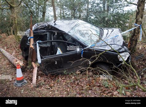 A Crashed Car A Black Volkswagen Polo In A Country Lane Surrounded By