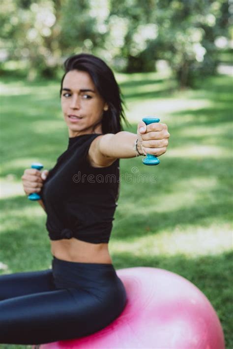 Young Happy Fit Tanned Brunette Goes In For Sports With A Big Fitness