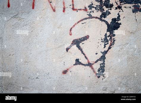 Old grungy communism symbol graffiti on a wall, red color Stock Photo ...