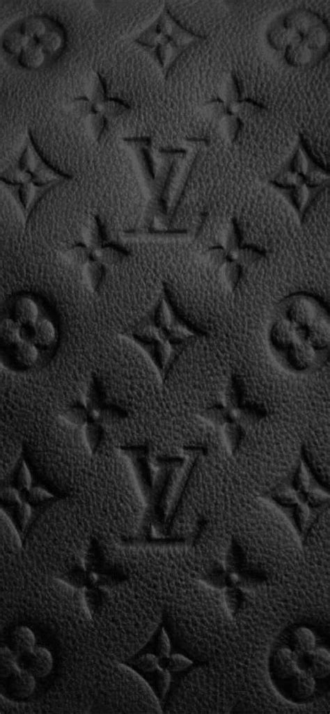 Black And White Photograph Of Louis Vuitton Monogramed Pattern On An Upholstered Surface