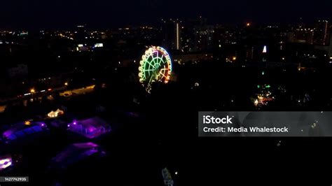 Aerial Night View Of City Skyline And Ferris Wheel Top View Of Ferris ...