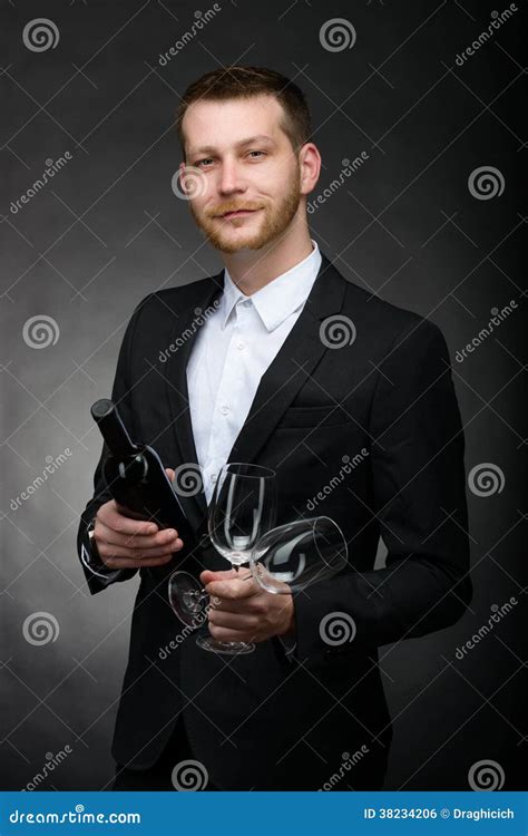 Handsome Romantic Man Holding Bottle And Glasses Of Wine Stock Photo