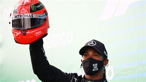 Lewis Hamilton lifts Schumacher's old helmet after equalling German's ...