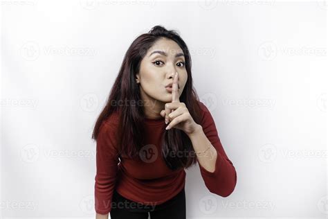 Portrait Of A Young Asian Woman Tell Be Quiet Shushing With Serious