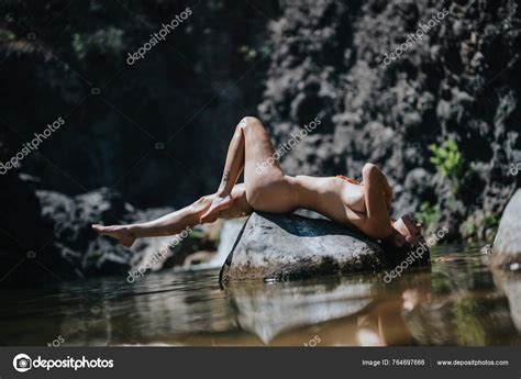 Nude Woman Lying Rock Water Embracing Nature Calm Serene Setting Stock Photo Gorgev 764697666