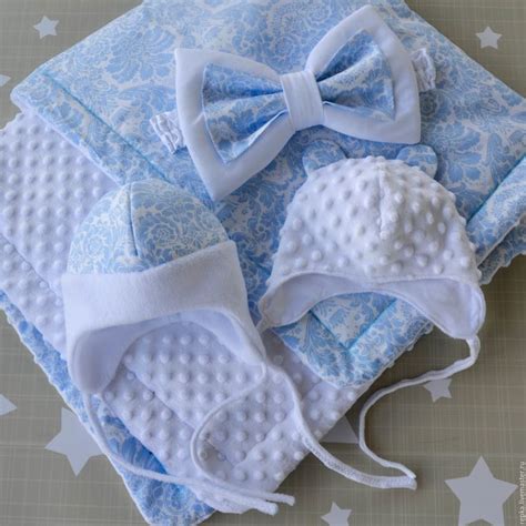 three pieces of blue and white cloth with bows on them