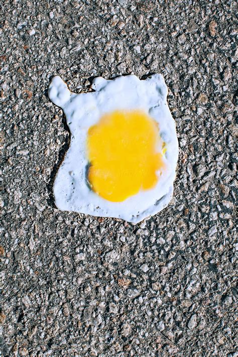 Its So Damn Hot You Can Fry An Egg On The Ground By Stocksy Contributor Carolyn Lagattuta