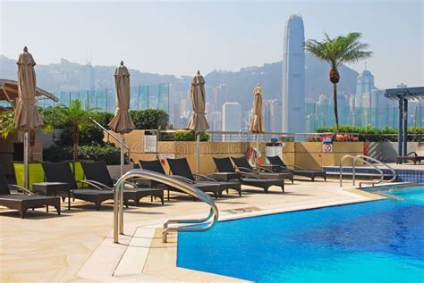 Hotel Rooftop Swimming Pool with Deckchair Stock Image - Image of cloudless, architecture: 36096881