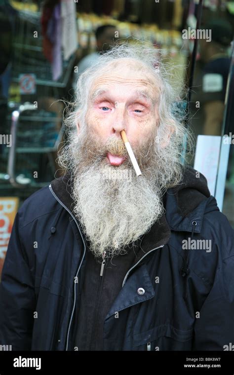 Close up portrait of a homeless guy with a cigarette on his nose Stock ...