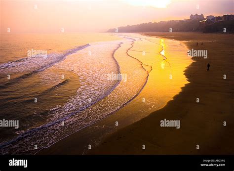 Sunset over Whitby beach Stock Photo - Alamy