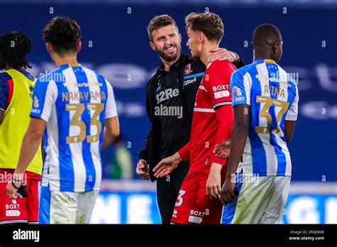 Middlesbrough Manager Michael Carrick Talks With Rav Van Den Berg Of