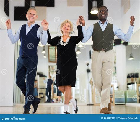 Elderly Woman With Two Men Dancing Together Stock Image Image Of