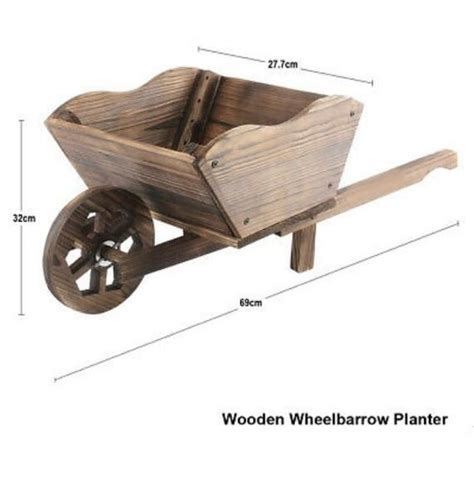 Wooden Wheel Barrow Planter Etsy Wheelbarrow Wheelbarrow Planter Rustic Wheelbarrows