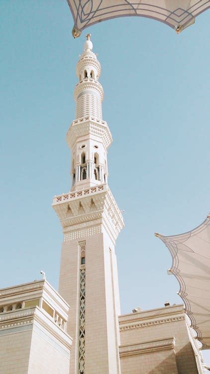Low Angle Shot of White Tower Under the Blue Sky · Free Stock Photo