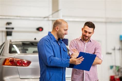 Auto Mechanic With Clipboard And Man At Car Shop Stock Image Image Of