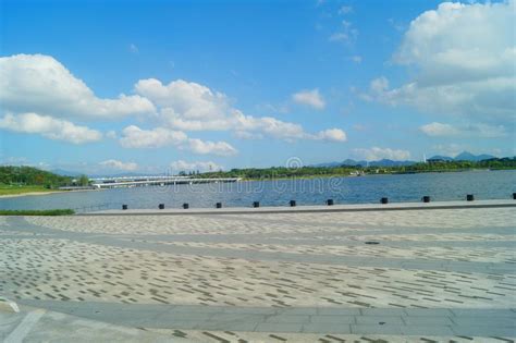 The Lake Landscape Under The Blue Sky And White Clouds Is Very