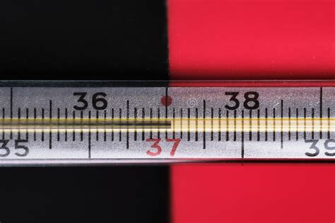 An Old Mercury Thermometer Shows A Temperature Of 37 Close Up Black