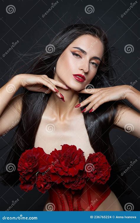 Beautiful Brunette Woman With A Bouquet Of Red Rose Flowers In Red Corset Long Hair Nude Slim