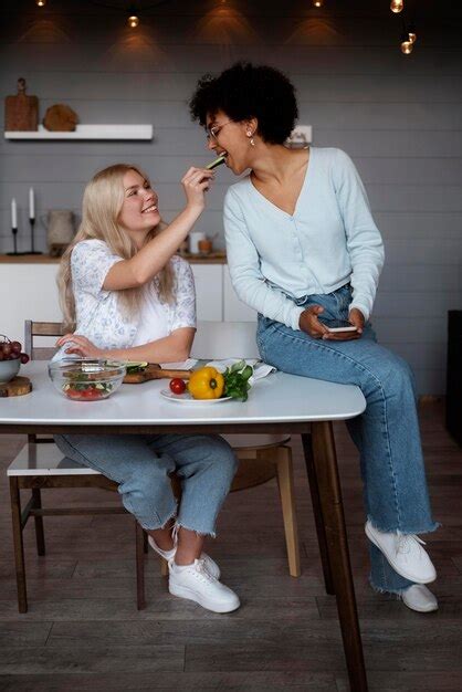 Free Photo Lovely Lesbian Couple Spending Time Together In The Kitchen