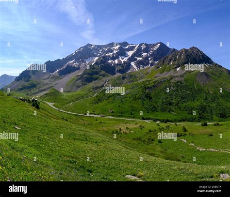 Mountains And Green Alpine Meadows Views Near Col Du Lautaret Massif