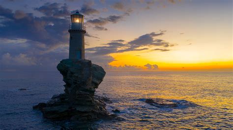 The Beautiful Lighthouse Tourlitis Of Chora In Andros Island Cyclades