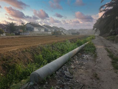 Sunrise Scene Of Digger Moving Soil Into Back Of Large Truck At The New