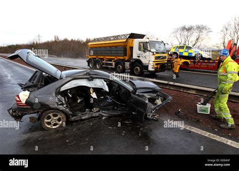 Scottish Motorway Crash A Gritter Passes A Wrecked Car After Four