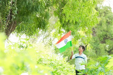 Indian boy holding national flag in farm, happy boy, national flag ...