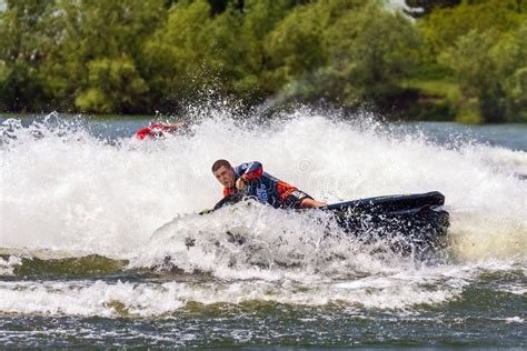 BRP Sea-Doo Jet Ski Man in Action Making Turn and Splashing Outdoor at ...