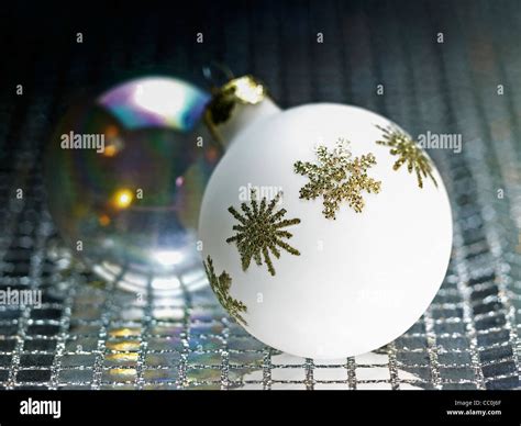 Ornamented White Christmas Bauble In Decorative Metallic Back Stock