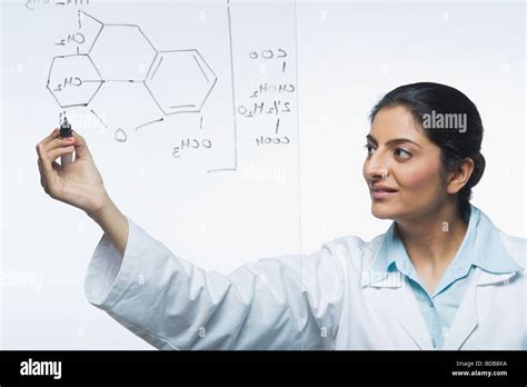 Scientist Writing Chemical Formula Stock Photo Alamy