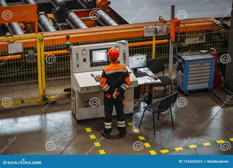 Factory Worker Monitoring CNC Machine in Metalworking Workshop ...