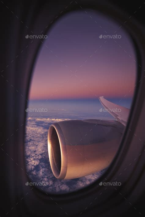 View from window of airplane during night flight Stock Photo by Chalabala