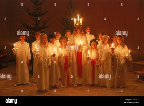 Choir of children with candles on Saint Lucia Day in Sweden Stock Photo ...