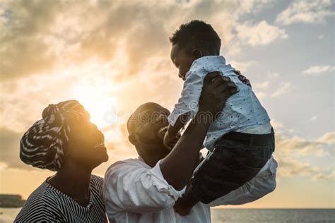 Happy African Family Having Fun on the Beach during Summer Holidays ...