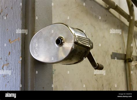 Vintage metal pencil sharpener mounted on wall Stock Photo - Alamy